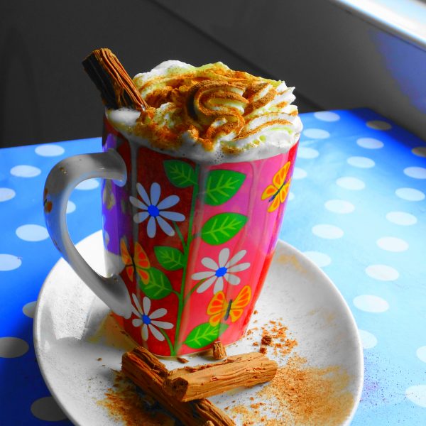 A hot chocolate topped with whipped cream and a Flake at Oak Hill Park Cafe